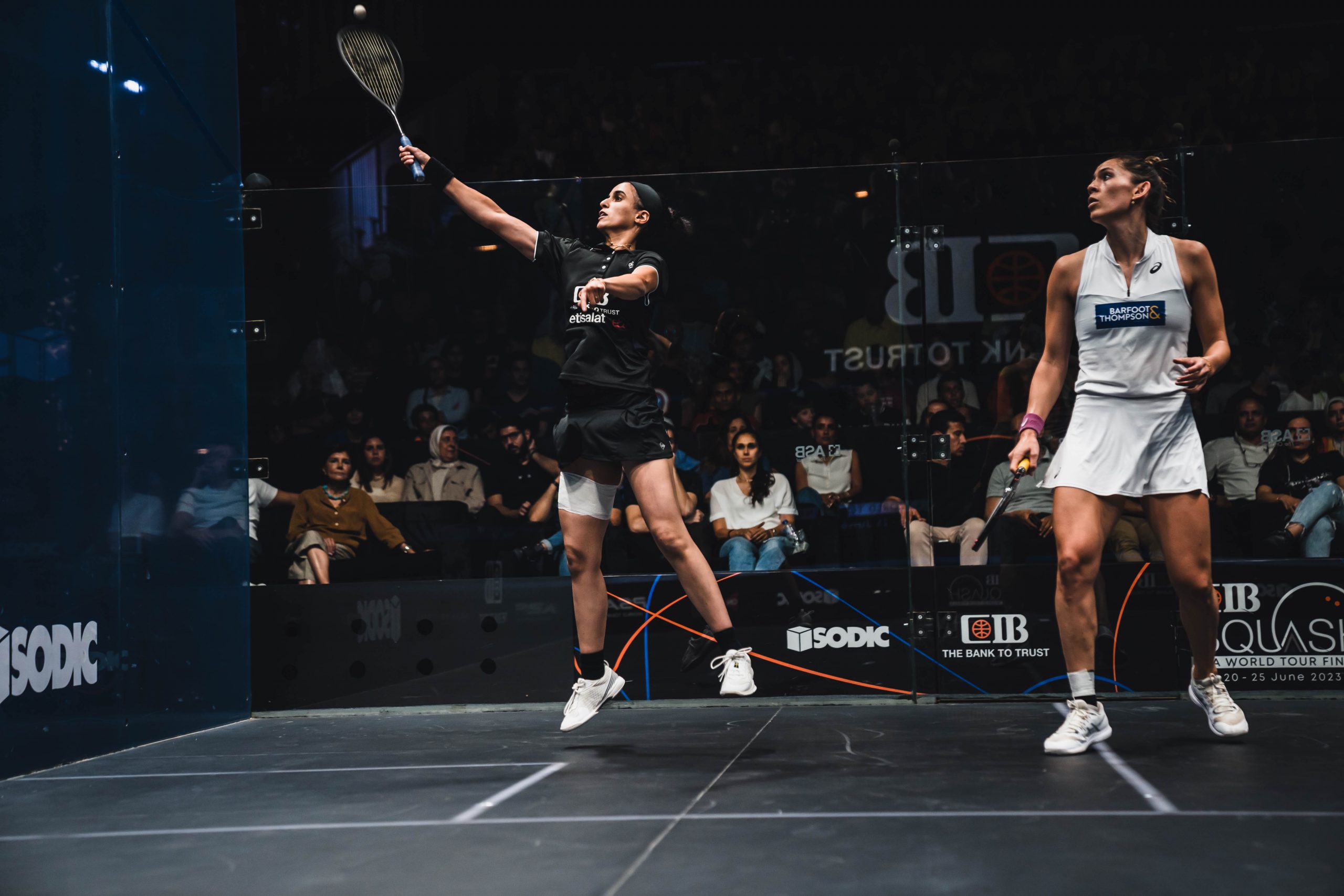 Nour El Tayeb (left) takes on Joelle King (right) during the 2022-23 CIB PSA World Tour Finals.