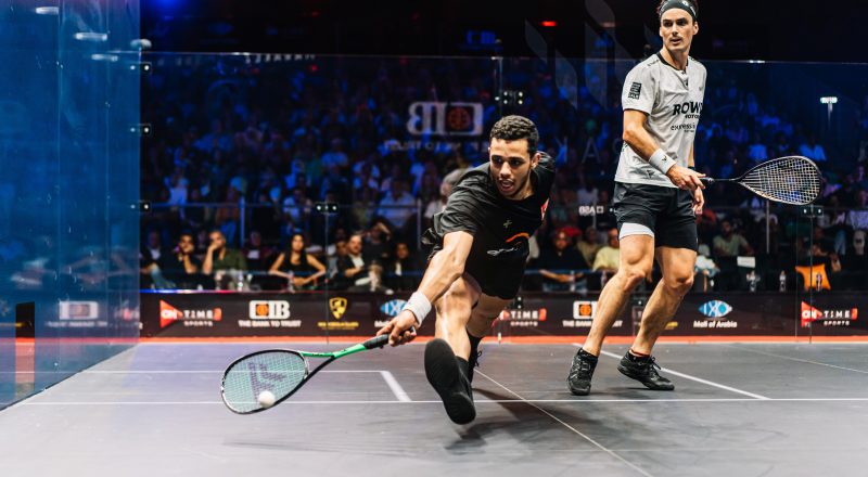 Mostafa Asal (left) takes on Paul Coll (right) during the men's 2022-23 CIB PSA World Tour Finals title decider.