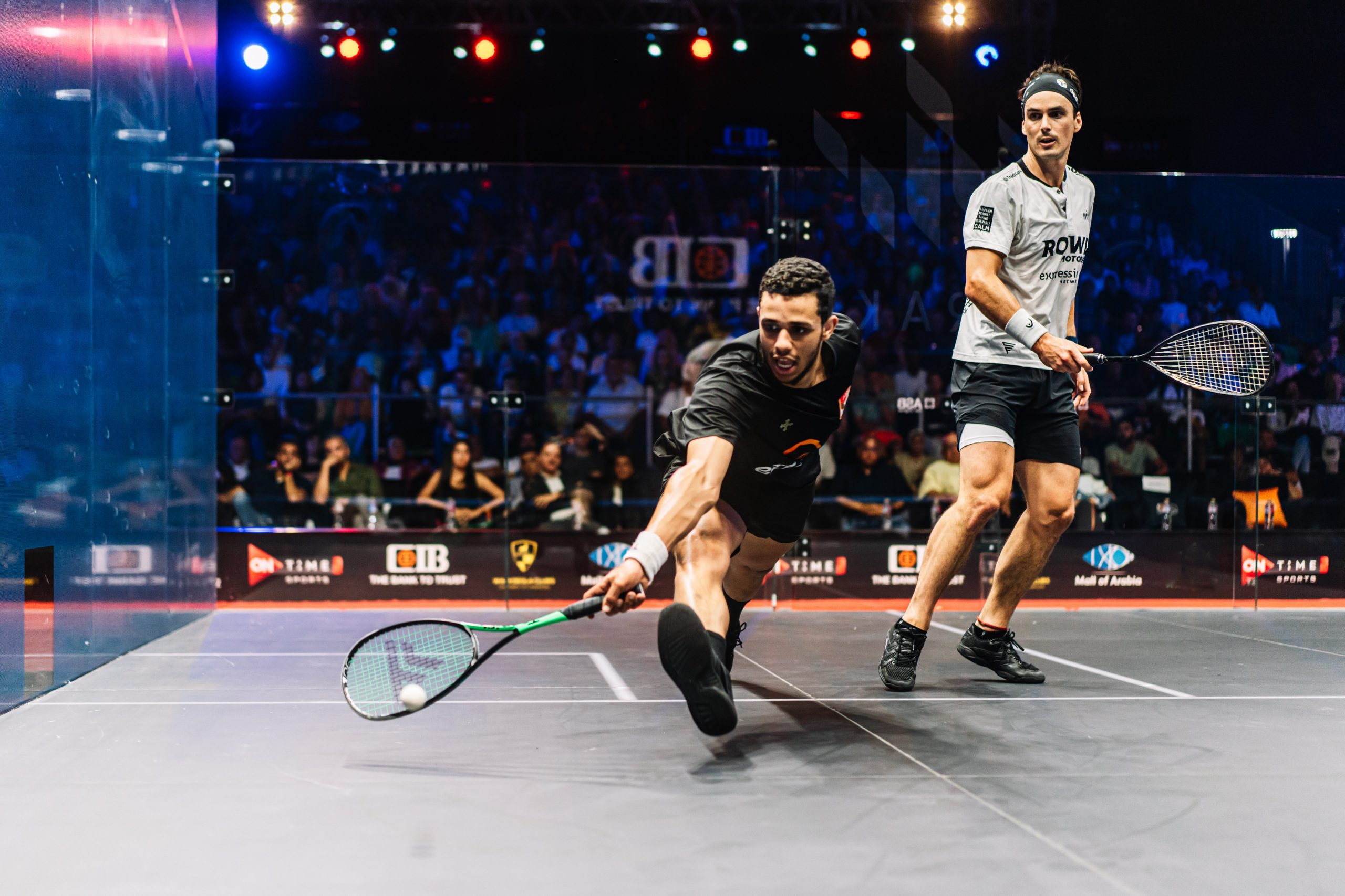 Mostafa Asal (left) takes on Paul Coll (right) during the men's 2022-23 CIB PSA World Tour Finals title decider.