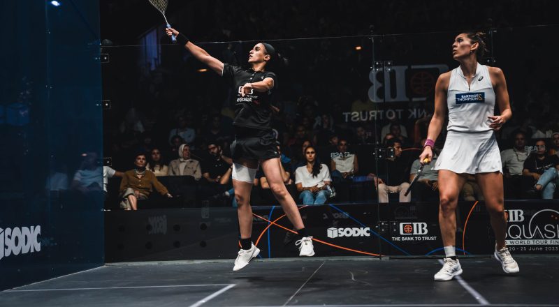 Nour El Tayeb (left) takes on Joelle King (right) during the 2022-23 CIB PSA World Tour Finals.